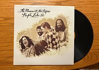 Front cover of People Like Us LP and visible vinyl