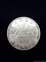 Reverse side showing canoe design and 1966 date