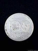 Reverse with Winnipeg centennial design and dates