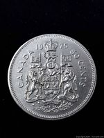 Reverse side showing Canadian coat of arms, denomination and date
