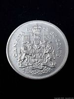 Reverse of 1976 Canadian 50-cent coin showing coat of arms and denomination