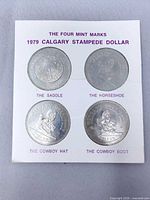 Front view of four-coin display card showing all coins and printed titles