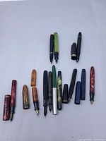 Group shot showing all 12 pen parts, various colours and materials