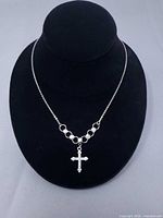 Full view of necklace on bust showing chain, links, and pendant