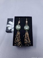 Full view of earrings in gift box