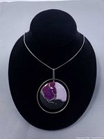 Pendant on chain displayed on bust form