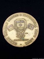 Obverse with crest, flags, 35th anniversary text