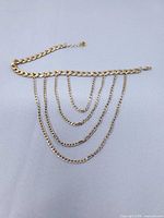 Full bracelet laid flat showing cascading chains