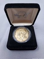 Medallion in velvet box, obverse visible