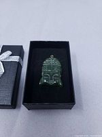 Pendant in gift box showing front view