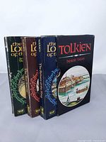 Front view of three paperbacks and slipcase