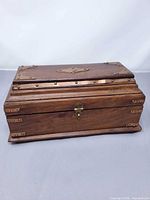 closed mahogany writing box with brass fittings