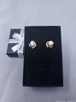 Pair of gold and pearl earrings in gift box