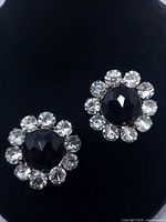 Both brooches front view on black background