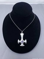 Full view of pendant on chain displayed on bust