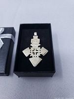 Pendant in gift box showing front design