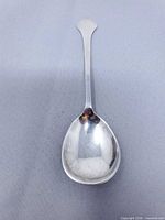 front view of sterling silver spoon showing bowl and handle