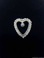front view of heart rhinestone brooch