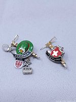 Front view of both enamel souvenir pins