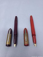 Both Eclipse Hooded Knight fountain pens with caps removed showing nibs