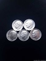 Front view of brooch showing five Roosevelt dime obverses