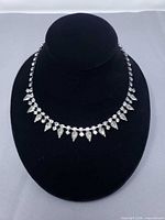 Full view of rhinestone necklace on display bust