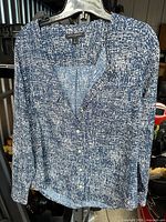 Front view of blue/white Banana Republic button shirt on hanger