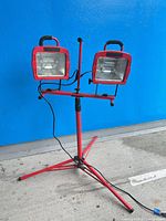 Full view of red tripod work light with two lamps