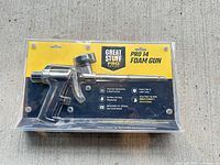 Front view of sealed Great Stuff Pro 14 foam gun package