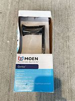 Moen Genta pivoting toilet paper holder in box