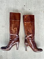Side-by-side view of both boots showing full shafts, heels, and toe shape