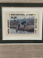 Close-up of affixed 1992 $5 New Jersey Waterfowl Stamp (#001500) showing Bluebills illustration