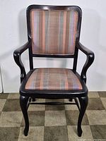 Front view of accent chair showing upholstered back and seat