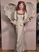 Full view of standing angel sculpture front