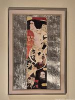 Full view of framed reproduction painting in metallic frame