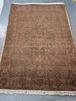 Full view of handmade Persian Bijar wool rug showing overall pattern, colors, and fringe