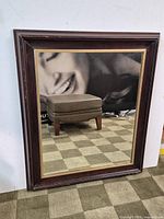 Full view of rectangular wood-framed floor mirror