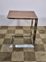 Side profile showing full C-shaped frame and tabletop