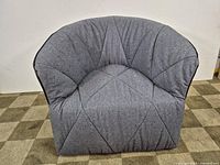 Front full view of gray diamond-tufted armchair