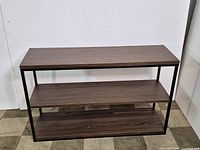 Front view of rectangular wood console table with two shelves