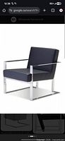 Catalog image of Motivo armchair showing stainless frame and dark leather