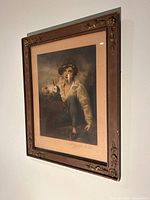 Full view of framed print on wall showing frame and artwork