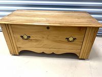 front view showing drawer front, handles, keyhole, overall finish