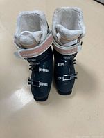 Front view of both Rossignol ski boots showing buckles, straps, and liners