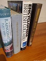 Spines of the four hardcover books