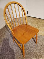 Front view showing seat, spindle back and finish