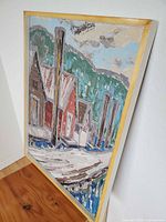 Oblique view of framed oil painting showing boathouse scene