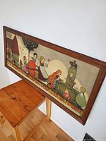 Full view of framed print on wall showing illustration and frame