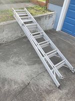 Ladder laid flat showing rungs and rails