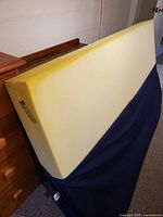 Foam core exposed showing thickness and yellow foam material